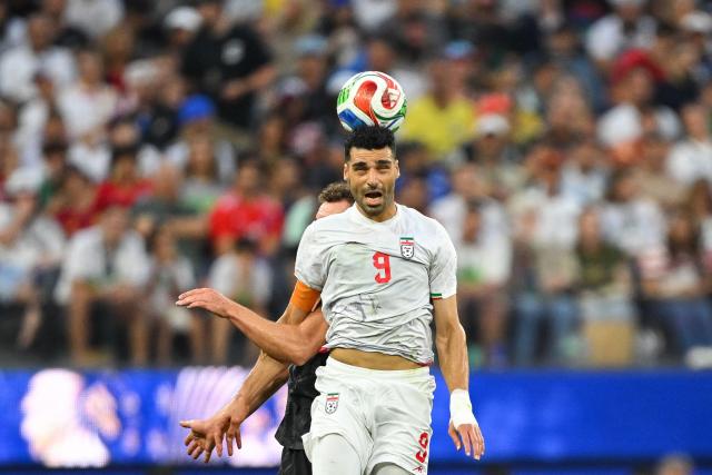 Iran's forward #09 Mehdi Taremi heads the ball during the 2026 World Cup Group G football match between Iran and New Zealand at Los Angeles Stadium in Inglewood on June 15, 2026.  (Photo by Patrick T. Fallon / AFP)