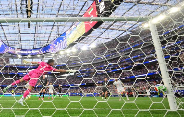 New Zealand's goalkeeper #01 Max Crocombe concedes Iran's second goal scored by midfielder #08 Mohammad Mohebbi (unseen) during the 2026 World Cup Group G football match between Iran and New Zealand at Los Angeles Stadium in Inglewood on June 15, 2026.  (Photo by Frederic J. Brown / AFP)