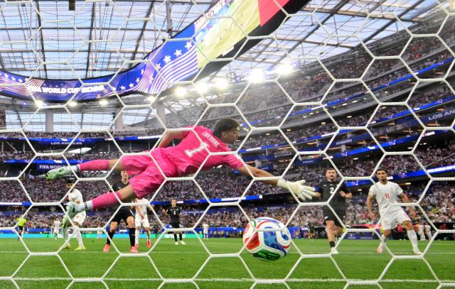 New Zealand's goalkeeper #01 Max Crocombe concedes Iran's second goal scored by midfielder #08 Mohammad Mohebbi during the 2026 World Cup Group G football match between Iran and New Zealand at Los Angeles Stadium in Inglewood on June 15, 2026.  (Photo by Frederic J. Brown / AFP)