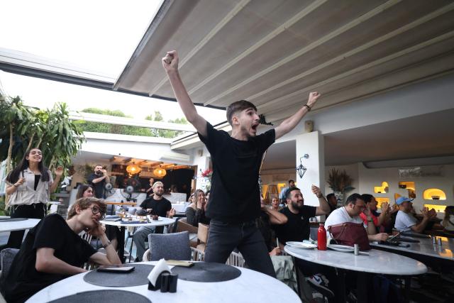 Iranians react to the 2026 World Cup football tournament match between Iran and New Zealand at a cafe in Tehran, Iran, on June 16, 2026. (Photo by ATTA KENARE / AFP) / Israel OUT/NO Access Israel Media/Persian Language TV Stations Outside Iran/Strictly No Access BBC Persian/VOA Persian/Manoto TV/Iran International TV