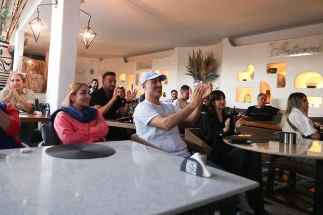 Iranians watch the 2026 World Cup football tournament match between Iran and New Zealand at a cafe in Tehran, Iran, on June 16, 2026. (Photo by ATTA KENARE / AFP) / Israel OUT/NO Access Israel Media/Persian Language TV Stations Outside Iran/Strictly No Access BBC Persian/VOA Persian/Manoto TV/Iran International TV