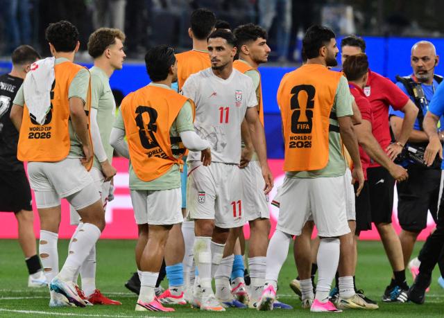 Iran's forward #11 Ali Alipour and teammates react after the 2026 World Cup Group G football match between Iran and New Zealand at Los Angeles Stadium in Inglewood on June 15, 2026.  (Photo by Frederic J. Brown / AFP)