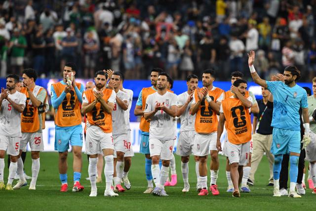 Iran's players greet supporters after the 2026 World Cup Group G football match between Iran and New Zealand at Los Angeles Stadium in Inglewood on June 15, 2026.  (Photo by Patrick T. Fallon / AFP)