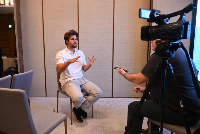Norwegian chess grandmaster Magnus Carlsen speaks to AFP ahead of the FIDE World Team Rapid and Blitz Chess Championships in Hong Kong on June 16, 2026. This year's chess tournament will be held in the city from June 16-22. (Photo by Peter PARKS / AFP)