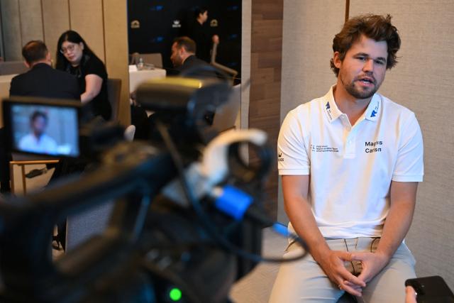 Norwegian chess grandmaster Magnus Carlsen speaks to AFP ahead of the FIDE World Team Rapid and Blitz Chess Championships in Hong Kong on June 16, 2026. This year's chess tournament will be held in the city from June 16-22. (Photo by Peter PARKS / AFP)