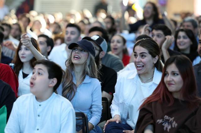 Iranians react while watching the 2026 World Cup football tournament match between Iran and New Zealand at Tehran Book Garden in Tehran, Iran, on June 16, 2026. (Photo by AFP)