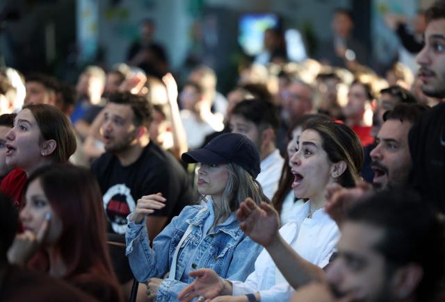 Iranians react while watching the 2026 World Cup football tournament match between Iran and New Zealand at Tehran Book Garden in Tehran, Iran, on June 16, 2026. (Photo by AFP)