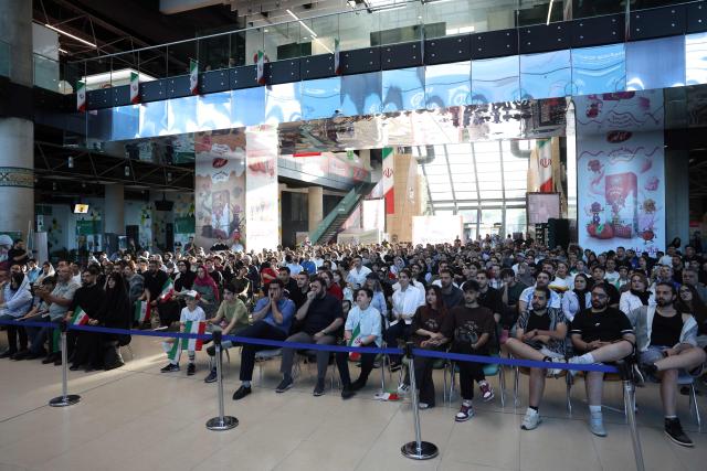 Iranians watch the 2026 World Cup football tournament match between Iran and New Zealand at Tehran Book Garden in Tehran, Iran, on June 16, 2026. (Photo by AFP)