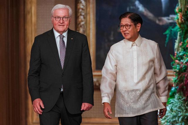German President Frank-Walter Steinmeier (L) walks with Philippine President Ferdinand Marcos at the Malacanang Palace in Manila on June 16, 2026. (Photo by Ezra Acayan / POOL / AFP)