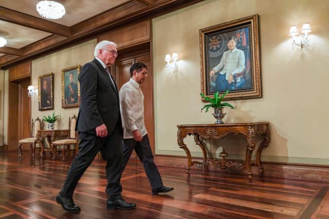 German President Frank-Walter Steinmeier (L) walks with Philippine President Ferdinand Marcos at the Malacanang Palace in Manila on June 16, 2026. (Photo by Ezra Acayan / POOL / AFP)