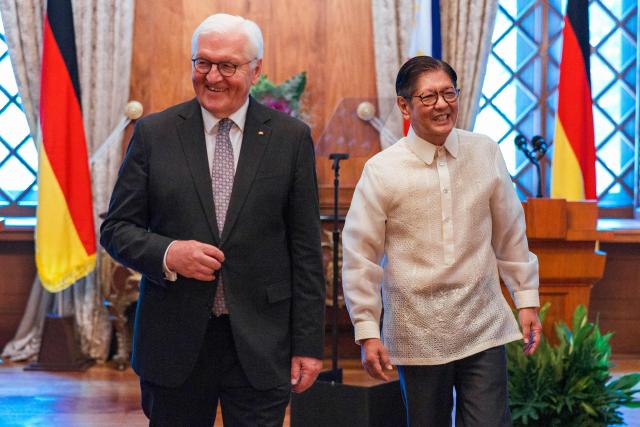 German President Frank-Walter Steinmeier (L) walks with Philippine President Ferdinand Marcos following a press conference at the Malacanang Palace in Manila on June 16, 2026. (Photo by Ezra Acayan / POOL / AFP)