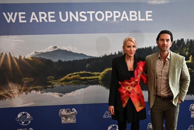 Heather Mills (L) and partner Mike Dickmann pose for a picture arriving for the Schwarzenegger climate initiative conference in Vienna, Austria on June 16, 2026. Former actor and politician Arnold Schwarzenegger hosts an annual conference on climate change in his native country. (Photo by Joe Klamar / AFP)