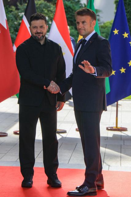 France's President Emmanuel Macron greets Ukraine's President Volodymyr Zelensky ahead of the working session with G7 leaders and Ukraine during the G7 summit, in Evian, eastern France, on June 16, 2026. A G7 summit is set to take place June 15 to 17 in the French town of Evian-les-Bains near Switzerland and it will be attended by country leaders as well as the EU's foreign policy chief and ministers from Brazil, Canada, the United Arab Emirates and Turkey. (Photo by Ludovic MARIN / AFP)