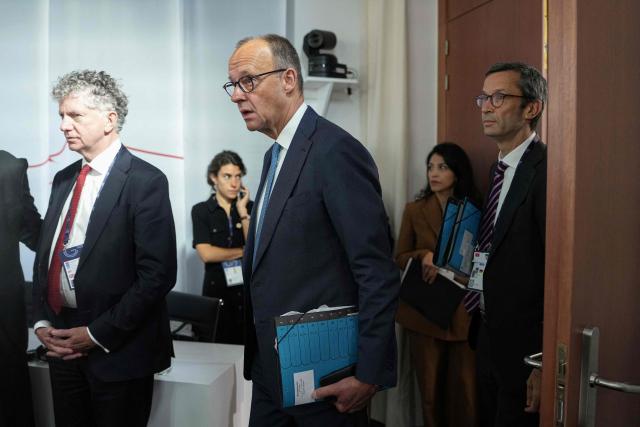 Germany's Chancellor Friedrich Merz (C) arrives to take part in a working session at the G7 summit in Evian-les-Bains, central-eastern France on June 16, 2026. (Photo by Thibault Camus / POOL / AFP)