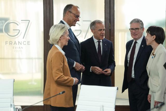 (From L) European Commission President Ursula von der Leyen, Germany's Chancellor Friedrich Merz, Canada's Prime Minister Mark Carney, Britain's Prime Minister Keir Starmer and Japan's Prime Minister Sanae Takaichi react during a working session at the G7 summit in Evian-les-Bains, central-eastern France on June 16, 2026. (Photo by Thibault Camus / POOL / AFP)