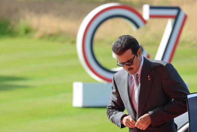 Qatar's Emir Sheikh Tamim bin Hamad al-Thani arrives ahead of a meeting as part of the G7 summit, in Evian, eastern France, on June 16, 2026. A G7 summit is set to take place June 15 to 17 in the French town of Evian-les-Bains near Switzerland and it will be attended by country leaders as well as the EU's foreign policy chief and ministers from Brazil, Canada, the United Arab Emirates and Turkey. (Photo by Ludovic MARIN / AFP)