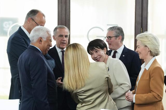 (From L) European Council President Antonio Costa, Germany's Chancellor Friedrich Merz, Canada's Prime Minister Mark Carney, Italy’s Prime Minister Giorgia Meloni, Japan's Prime Minister Sanae Takaichi, Britain's Prime Minister Keir Starmer and European Commission President Ursula von der Leyen react during a working session at the G7 summit in Evian-les-Bains, central-eastern France on June 16, 2026. (Photo by Thibault Camus / POOL / AFP)