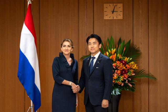 Netherlands' Deputy Prime Minister and Defence Minister Dilan Yesilgoz-Zegerius (L) and Japan's Defense Minister Shinjiro Koizumi shake hands during the Japan–Netherlands Defense Ministers' Meeting in Tokyo on June 16, 2026. (Photo by Philip FONG / AFP)