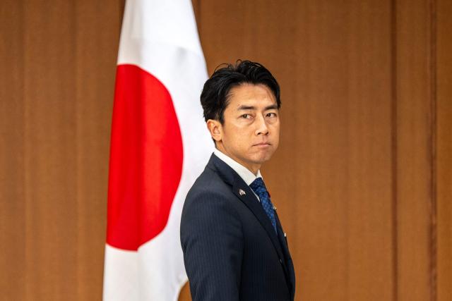 Japan's Defense Minister Shinjiro Koizumi stands before greeting Netherlands' Deputy Prime Minister and Defence Minister Dilan Yesilgoz-Zegerius during the Japan–Netherlands Defense Ministers' Meeting in Tokyo on June 16, 2026. (Photo by Philip FONG / AFP)