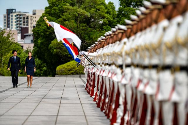Netherlands' Deputy Prime Minister and Defence Minister Dilan Yesilgoz-Zegerius (R) and Japan's Defense Minister Shinjiro Koizumi (L) inspect an honour guard during the Japan–Netherlands Defense Ministers' Meeting in Tokyo on June 16, 2026. (Photo by Philip FONG / AFP)