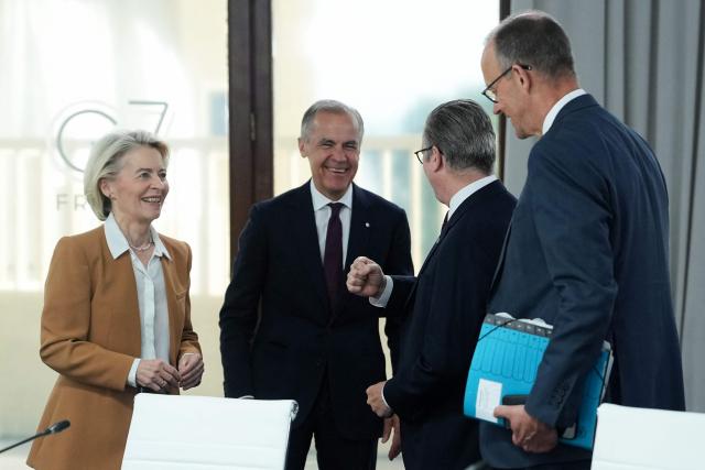 (From L) European Commission President Ursula von der Leyen, Canada's Prime Minister Mark Carney, Britain's Prime Minister Keir Starmer and Germany's Chancellor Friedrich Merz react ahead of a working session at the G7 summit in Evian-les-Bains, central-eastern France on June 16, 2026. (Photo by Thibault Camus / POOL / AFP)