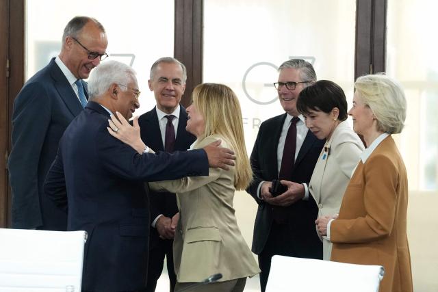 (From L) Germany's Chancellor Friedrich Merz, European Council President Antonio Costa, Canada's Prime Minister Mark Carney, Italy’s Prime Minister Giorgia Meloni,  Britain's Prime Minister Keir Starmer, Japan's Prime Minister Sanae Takaichi and European Commission President Ursula von der Leyen react during a working session at the G7 summit in Evian-les-Bains, central-eastern France on June 16, 2026. (Photo by Thibault Camus / POOL / AFP)