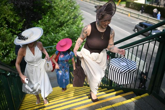 Racegoers arrive on the first day of the Royal Ascot horse racing meeting in Ascot, west of London, on June 16, 2026. (Photo by JUSTIN TALLIS / AFP)