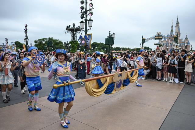 Disney cast members perform during a parade at Shanghai Disney Resort in Shanghai on June 16, 2026. (Photo by Jade Gao / AFP)