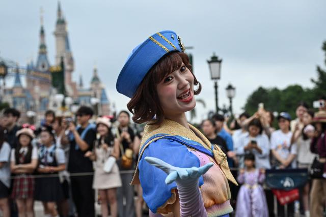 A Disney cast member performs during a parade at Shanghai Disney Resort in Shanghai on June 16, 2026. (Photo by Jade Gao / AFP)