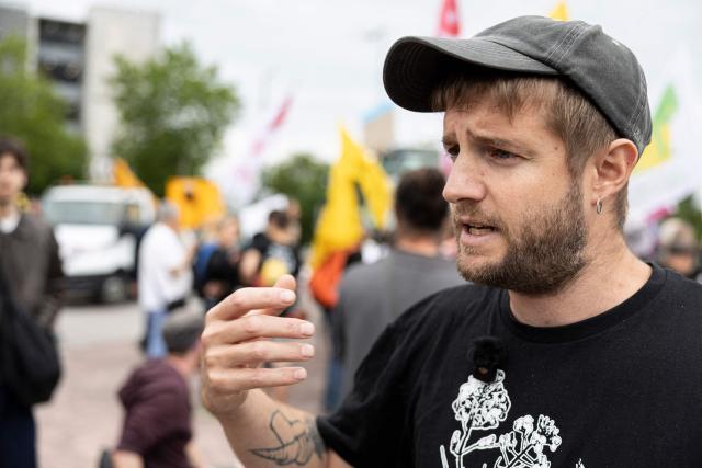 National spokesperson of the collective Farmers' Confederation Thomas Gibert speaks to the press as protestors gather in front of the European Parliament during a demonstration to call MEPs to vote against a proposal to deregulate genetically modified organisms, in Strasbourg, eastern France on June 16, 2026. (Photo by ROMEO BOETZLE / AFP)