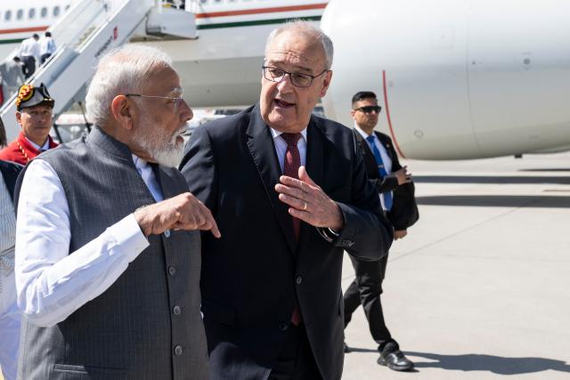 Switzerland's President Guy Parmelin welcomes India's Prime Minister Narendra Modi as he arrives to attend the G7 summit, at Geneva Airport on June 16, 2026. A G7 summit is set to take place June 15 to 17 in the French town of Evian-les-Bains near Switzerland and it will be attended by country leaders as well as the EU's foreign policy chief and ministers from Brazil, Canada, the United Arab Emirates and Turkey. (Photo by MARTIAL TREZZINI / POOL / AFP)