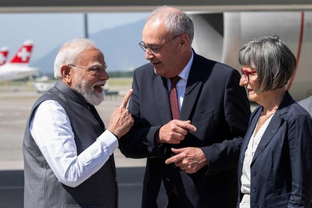 Switzerland's President Guy Parmelin (C) and his wife Caroline (R) welcome India's Prime Minister Narendra Modi as he arrives to attend the G7 summit, at Geneva Airport on June 16, 2026. A G7 summit is set to take place June 15 to 17 in the French town of Evian-les-Bains near Switzerland and it will be attended by country leaders as well as the EU's foreign policy chief and ministers from Brazil, Canada, the United Arab Emirates and Turkey. (Photo by MARTIAL TREZZINI / POOL / AFP)