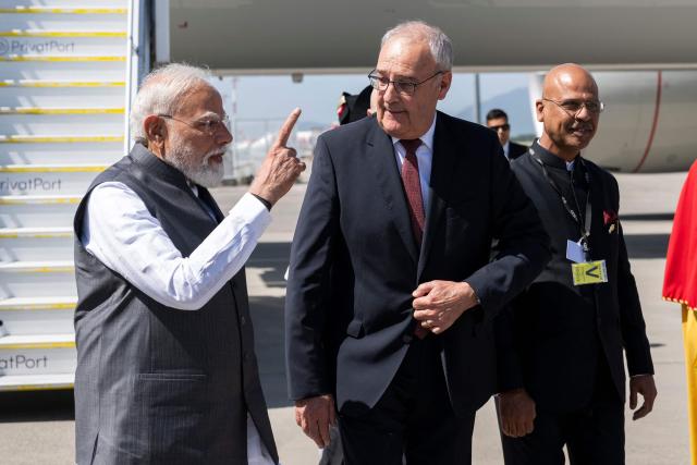 Switzerland's President Guy Parmelin welcomes India's Prime Minister Narendra Modi as he arrives to attend the G7 summit, at Geneva Airport on June 16, 2026. A G7 summit is set to take place June 15 to 17 in the French town of Evian-les-Bains near Switzerland and it will be attended by country leaders as well as the EU's foreign policy chief and ministers from Brazil, Canada, the United Arab Emirates and Turkey. (Photo by MARTIAL TREZZINI / POOL / AFP)