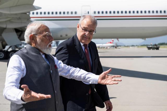 Switzerland's President Guy Parmelin welcomes India's Prime Minister Narendra Modi as he arrives to attend the G7 summit, at Geneva Airport on June 16, 2026. A G7 summit is set to take place June 15 to 17 in the French town of Evian-les-Bains near Switzerland and it will be attended by country leaders as well as the EU's foreign policy chief and ministers from Brazil, Canada, the United Arab Emirates and Turkey. (Photo by MARTIAL TREZZINI / POOL / AFP)
