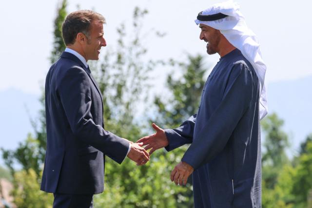 France's President Emmanuel Macron (L) welcomes United Arab Emirates' Crown prince Mohammed Bin Zayed Al Nahyan for the official greeting ahead of a work lunch as part of the G7 summit, in Evian, eastern France, on June 16, 2026. A G7 summit is set to take place June 15 to 17 in the French town of Evian-les-Bains near Switzerland and it will be attended by country leaders as well as the EU's foreign policy chief and ministers from Brazil, Canada, the United Arab Emirates and Turkey. (Photo by Ludovic MARIN / AFP)