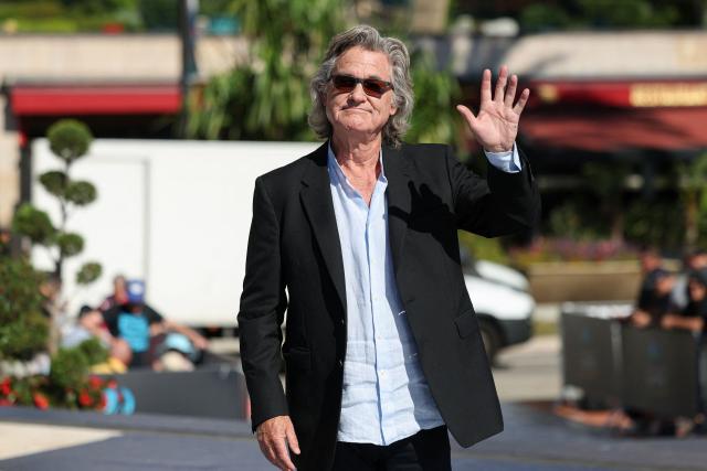 US actor Kurt Russel waves as he arrives to attend the 65th Monte-Carlo Television Festival in the principality of Monaco on June 16, 2026. (Photo by Valery HACHE / AFP)