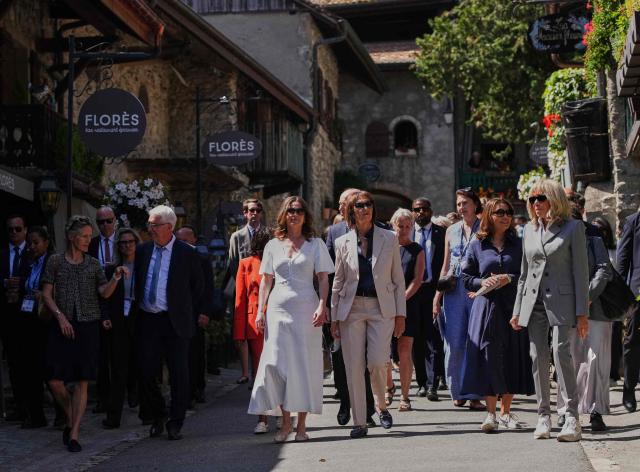 (From L) Leaders' spouses including Canada’s Diana Fox Carney, Britain’s Victoria Starmer,
Germany’s Charlotte Merz, Brazil's Rosangela "Janja" da Silva, and France’s Brigitte Macron walk in the street during a spouses' event on the sidelines of the G7 summit, in Yvoire, eastern France, on June 16, 2026.. A G7 summit is set to take place June 15 to 17 in the French town of Evian-les-Bains near Switzerland and it will be attended by country leaders as well as the EU's foreign policy chief and ministers from Brazil, Canada, the United Arab Emirates and Turkey. (Photo by Christophe Ena / POOL / AFP)