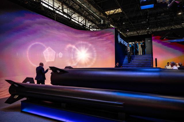 Visitors walk at the stand of Ukrainian defence technology company Fire Point during the Eurosatory land and airland defence and security trade fair, at the Paris-Nord Villepinte Exhibition Centre in Villepinte, north of Paris on June 15, 2026. (Photo by Guillaume BAPTISTE / AFP)