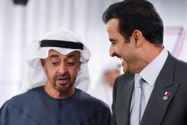 Qatar's Emir Sheikh Tamim bin Hamad al-Thani (R) and UAE's President Sheikh Mohamed bin Zayed al-Nahyan attend a work lunch as part of the G7 summit, in Evian, eastern France, on June 16, 2026. A G7 summit is set to take place June 15 to 17 in the French town of Evian-les-Bains near Switzerland and it will be attended by country leaders as well as the EU's foreign policy chief and ministers from Brazil, Canada, the United Arab Emirates and Turkey. (Photo by Christian Hartmann / POOL / AFP)