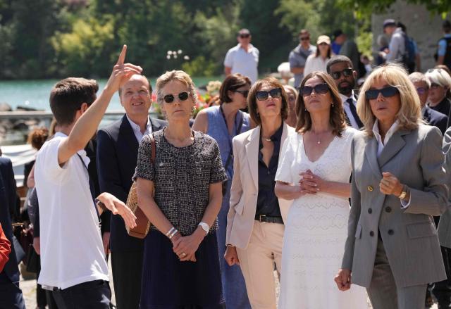 (From L) Leaders' spouses including Canada's Diana Fox Carney, Germany's Charlotte Merz, Britain's Victoria Starmer and France's Brigitte Macron attend a spouses' event on the sidelines of the G7 summit, in Yvoire, eastern France, on June 16, 2026. A G7 summit is set to take place June 15 to 17 in the French town of Evian-les-Bains near Switzerland and it will be attended by country leaders as well as the EU's foreign policy chief and ministers from Brazil, Canada, the United Arab Emirates and Turkey. (Photo by Christophe Ena / POOL / AFP)