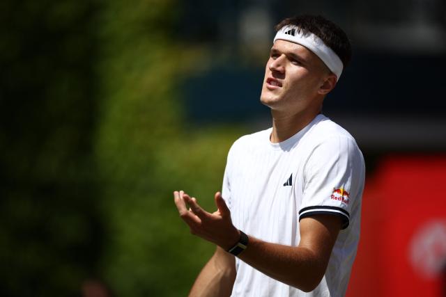 Czech Republic's Jakub Mensik reacts whilst playing against France's Adrian Mannarino during their men's singles round of 32 tennis match on day two of the ATP HSBC Championships at Queen's Club in west London on June 16, 2026. (Photo by Henry Nicholls / AFP)