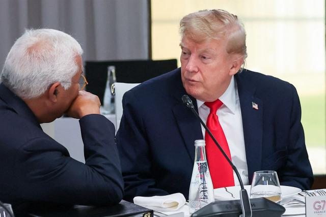 US President Donald Trump (R) speaks with European Council President Antonio Costa during a work lunch as part of the G7 summit, in Evian, eastern France, on June 16, 2026. A G7 summit is set to take place June 15 to 17 in the French town of Evian-les-Bains near Switzerland and it will be attended by country leaders as well as the EU's foreign policy chief and ministers from Brazil, Canada, the United Arab Emirates and Turkey. (Photo by Christian Hartmann / POOL / AFP)