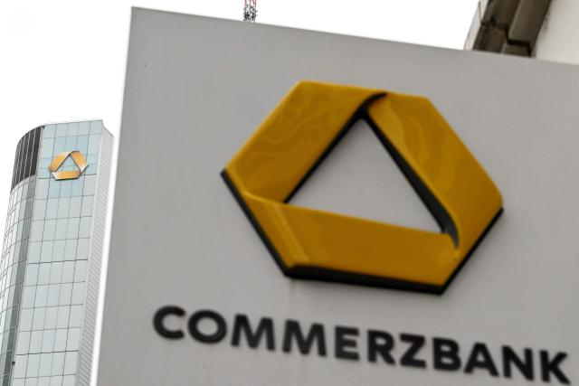 The bank's logo is seen on the Commerzbank building and a branch in the banking district in Frankfurt am Main, western Germany, on June 16, 2026. Tuesday, June 16, marks the final day for UniCredit's hostile and highly political takeover offer for Commerzbank, as Italy's second-largest bank has its sights on an ambitious pan-European banking merger. (Photo by Kirill KUDRYAVTSEV / AFP)