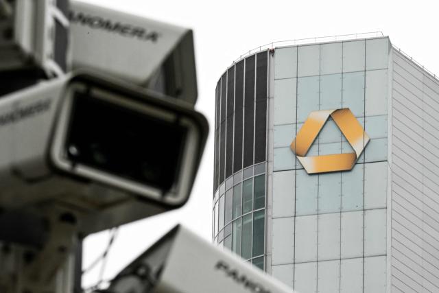 A surveillance camera is seen next to Commerzbank's logo on the Commerzbank building in the banking district in Frankfurt am Main, western Germany, on June 16, 2026. Tuesday, June 16, marks the final day for UniCredit's hostile and highly political takeover offer for Commerzbank, as Italy's second-largest bank has its sights on an ambitious pan-European banking merger. (Photo by Kirill KUDRYAVTSEV / AFP)