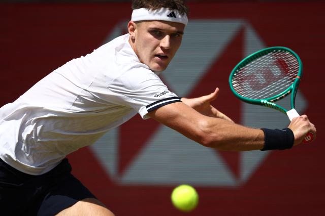 Czech Republic's Jakub Mensik returns against France's Adrian Mannarino during their men's singles round of 32 tennis match on day two of the ATP HSBC Championships at Queen's Club in west London on June 16, 2026. (Photo by Henry Nicholls / AFP)