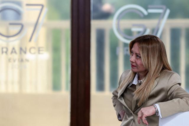 Italy's Prime Minister Giorgia Meloni attends a work lunch as part of the G7 summit, in Evian, eastern France, on June 16, 2026. A G7 summit is set to take place June 15 to 17 in the French town of Evian-les-Bains near Switzerland and it will be attended by country leaders as well as the EU's foreign policy chief and ministers from Brazil, Canada, the United Arab Emirates and Turkey. (Photo by Evelyn Hockstein / POOL / AFP)
