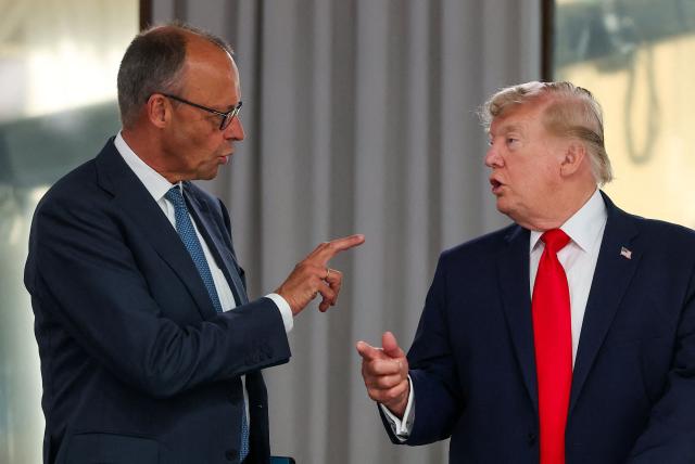Germany’s Chancellor Friedrich Merz and US President Donald Trump attend a work lunch as part of the G7 summit, in Evian, eastern France, on June 16, 2026. A G7 summit is set to take place June 15 to 17 in the French town of Evian-les-Bains near Switzerland and it will be attended by country leaders as well as the EU's foreign policy chief and ministers from Brazil, Canada, the United Arab Emirates and Turkey. (Photo by Christian Hartmann / POOL / AFP)