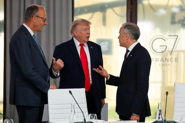 Germany’s Chancellor Friedrich Merz (L), US President Donald Trump (C) and Canada’s Prime Minister Mark Carney (R) attend a work lunch as part of the G7 summit, in Evian, eastern France, on June 16, 2026. A G7 summit is set to take place June 15 to 17 in the French town of Evian-les-Bains near Switzerland and it will be attended by country leaders as well as the EU's foreign policy chief and ministers from Brazil, Canada, the United Arab Emirates and Turkey. (Photo by Christian Hartmann / POOL / AFP)