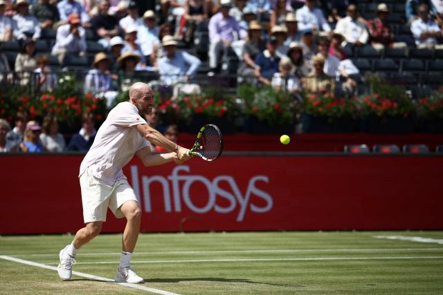 France's Adrian Mannarino returns against Czech Republic's Jakub Mensik during their men's singles round of 32 tennis match on day two of the ATP HSBC Championships at Queen's Club in west London on June 16, 2026. (Photo by Henry NICHOLLS / AFP)
