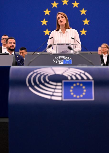 EU Parliament President Roberta Metsola (C) introduces President of Montenegro Jakov Milatovic (L) during a plenary session at the European Parliament in Strasbourg, eastern France, on June 16, 2026. (Photo by Jean-Christophe VERHAEGEN / AFP)